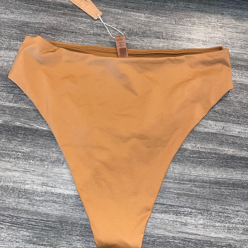 Skims high waisted swim bottoms